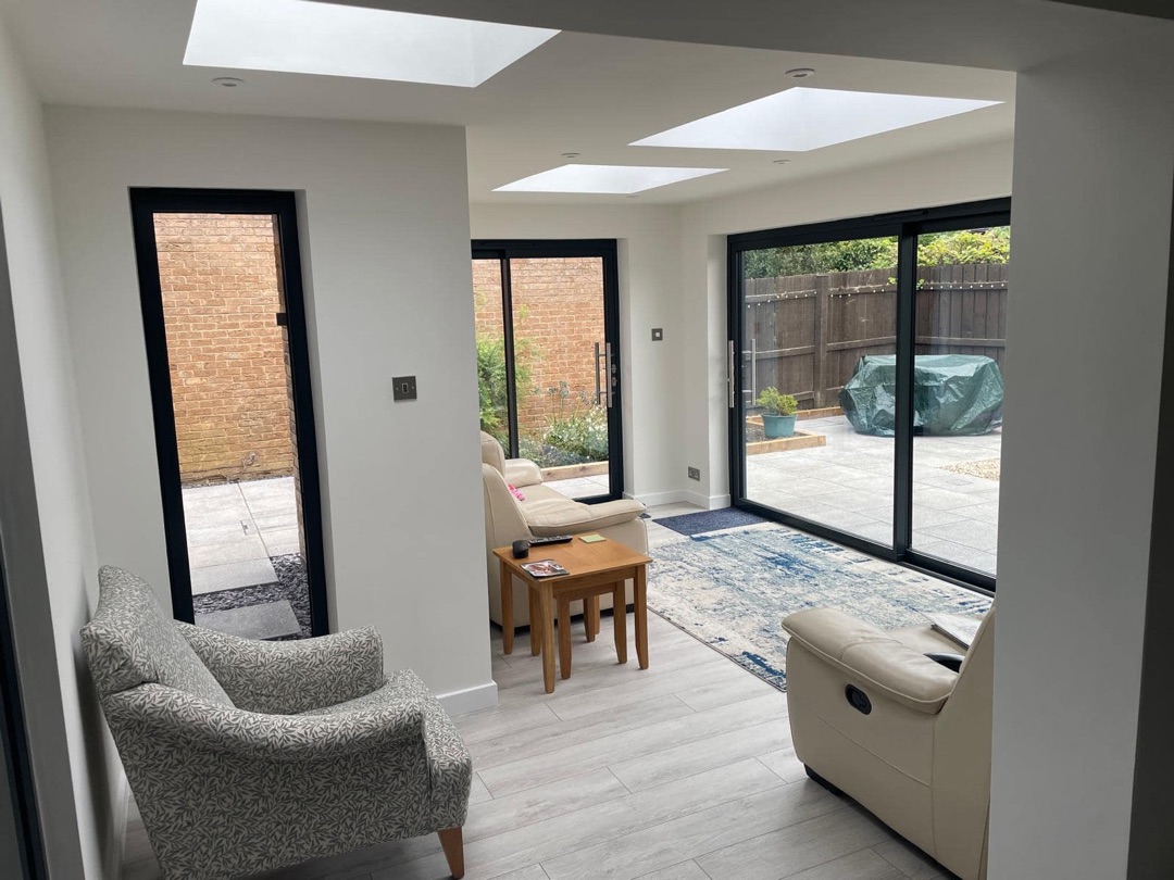 Prestbury extension interior with skylights and sliding doors by Constructs